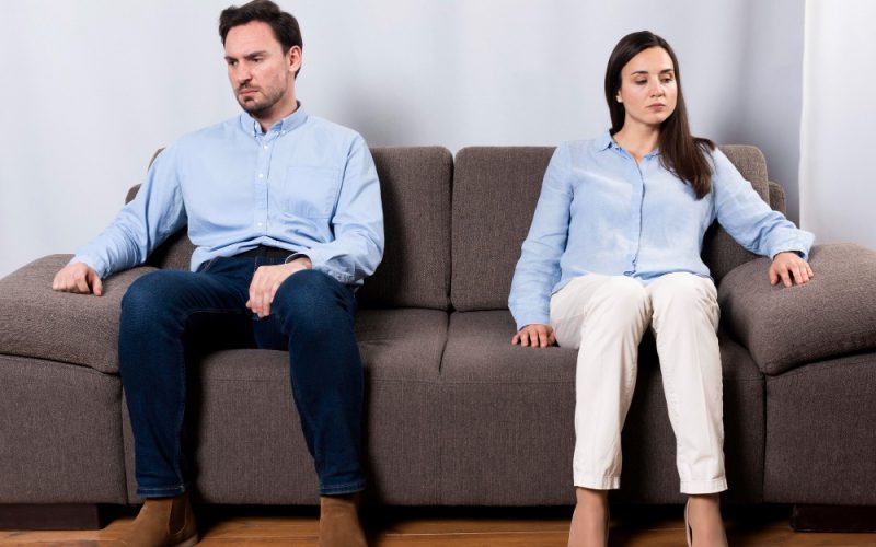 angry-male-and-woman-sitting-on-the-couch (1)